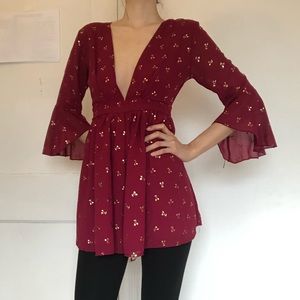 Red long bell sleeve romper with cherry print